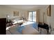 Well-lit living room with balcony access and classic furnishings, open and inviting at 1800 Clairmont Lk # A326, Decatur, GA 30033