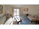 Cozy living room with sliding glass door to balcony, and traditional furnishings at 1800 Clairmont Lk # A326, Decatur, GA 30033