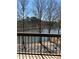 Balcony view of a tranquil lake surrounded by bare trees offering a serene natural setting at 1800 Clairmont Lk # A326, Decatur, GA 30033