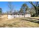 Home with a large grassy backyard and mature trees at 1113 Grace Sw St, Mableton, GA 30126