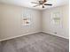 Light filled bedroom has two windows and neutral carpeting at 1113 Grace Sw St, Mableton, GA 30126