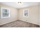 Neutral bedroom with two windows and plush carpeting at 1113 Grace Sw St, Mableton, GA 30126