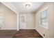 Dining area with wood floors, a rear entry door, and ample natural light at 1113 Grace Sw St, Mableton, GA 30126