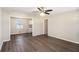 Open-concept living area with wood floors, connecting to a bright, renovated kitchen at 1113 Grace Sw St, Mableton, GA 30126