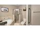 Neutral bathroom with a soaking tub, a glass-enclosed shower, and tiled floors at 3699 Ashford Creek Ne Hl, Atlanta, GA 30319