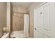 Bathroom features a tiled shower-tub combo, curtain and white colored door at 3699 Ashford Creek Ne Hl, Atlanta, GA 30319