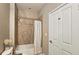 Neutral bathroom featuring a shower-tub combo with a shower curtain and tiled walls at 3699 Ashford Creek Ne Hl, Atlanta, GA 30319
