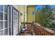 Outdoor deck area featuring outdoor seating with string lights and views of the surrounding trees at 3699 Ashford Creek Ne Hl, Atlanta, GA 30319