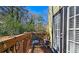 Cozy deck area featuring outdoor seating, string lights and views of the surrounding nature at 3699 Ashford Creek Ne Hl, Atlanta, GA 30319