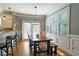 Eat-in kitchen with a wooden table set, pendant lighting, and lots of natural light at 3699 Ashford Creek Ne Hl, Atlanta, GA 30319