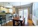 Eat-in kitchen with a wooden table, bench, and lots of natural light at 3699 Ashford Creek Ne Hl, Atlanta, GA 30319