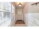 Entryway featuring hard wood floor, shiplap walls, and exterior door at 3699 Ashford Creek Ne Hl, Atlanta, GA 30319