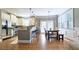 Bright eat-in kitchen featuring an island, granite countertops, stainless steel appliances, and lots of natural light at 3699 Ashford Creek Ne Hl, Atlanta, GA 30319
