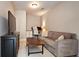 Living room with a large television, a desk area, and a comfortable couch at 3699 Ashford Creek Ne Hl, Atlanta, GA 30319