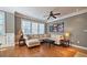 Comfortable living room with hardwood floors, large windows, and stylish furniture at 3699 Ashford Creek Ne Hl, Atlanta, GA 30319