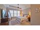 Bright main bedroom with large windows, a ceiling fan, and a neutral color palette at 3699 Ashford Creek Ne Hl, Atlanta, GA 30319