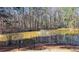 Beautiful pond view with a bench, fountain feature, and lush landscaping, perfect for relaxation and enjoying nature at 3699 Ashford Creek Ne Hl, Atlanta, GA 30319