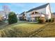 Manicured backyard showcasing a covered patio and lush green lawn at 3910 Cameron Ct, Cumming, GA 30040