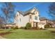 Two-story home with a well-maintained lawn and a side-entry two-car garage at 3910 Cameron Ct, Cumming, GA 30040