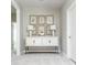 Hallway featuring console table with lamps and botanical print wall art at 3910 Cameron Ct, Cumming, GA 30040