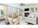 Bright and airy living room with a fireplace, built-in shelves, and lots of natural light at 3910 Cameron Ct, Cumming, GA 30040