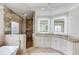 Elegant bathroom with granite counters, custom cabinets and lighting, and a walk-in shower at 2400 Weber Heights Way, Buford, GA 30519