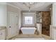 Luxurious bathroom featuring a standalone tub, decorative window, and a glass-enclosed shower at 2400 Weber Heights Way, Buford, GA 30519