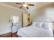 Relaxing bedroom with hardwood floors, a dresser, and a full bed at 2400 Weber Heights Way, Buford, GA 30519