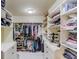 Walk-in closet with custom shelving and storage for clothes and accessories at 2400 Weber Heights Way, Buford, GA 30519