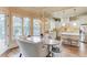 Bright dining area next to kitchen with large windows and stylish light fixtures at 2400 Weber Heights Way, Buford, GA 30519