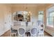 Dining area with hardwood floors and access to an outdoor porch at 2400 Weber Heights Way, Buford, GA 30519