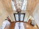 Grand foyer with decorative chandelier, double doors, hardwood floors, and stylish cowhide rug at 2400 Weber Heights Way, Buford, GA 30519