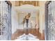 Grand foyer with gleaming hardwood floors, soaring ceilings, and an elegant staircase at 2400 Weber Heights Way, Buford, GA 30519