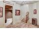 Hallway with wood-look tile, stairway and access to a home theater at 2400 Weber Heights Way, Buford, GA 30519