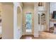 Hallway with hardwood floors, custom built-in cabinets and access to outdoor balcony at 2400 Weber Heights Way, Buford, GA 30519