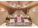 This home theater features comfortable leather seating, sconce lighting, and a projector for the ultimate viewing experience at 2400 Weber Heights Way, Buford, GA 30519