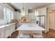 Elegant kitchen offers granite countertops, stainless steel appliances, and a center island with seating at 2400 Weber Heights Way, Buford, GA 30519