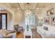 Bright living room featuring hardwood floors, coffered ceilings, and a large window at 2400 Weber Heights Way, Buford, GA 30519