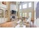 Spacious living room with high ceilings, stone fireplace, and built-in bookshelves at 2400 Weber Heights Way, Buford, GA 30519