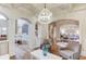 Open-concept living area with hardwood floors, archways, and views into other rooms at 2400 Weber Heights Way, Buford, GA 30519