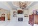 Comfortable main bedroom with a fireplace, built-in shelving, and ample natural light at 2400 Weber Heights Way, Buford, GA 30519