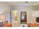 Home office that features a tray ceiling, full-length mirror and office furniture at 2400 Weber Heights Way, Buford, GA 30519