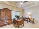Home office featuring built-in desk, cabinets, and lots of natural light at 2400 Weber Heights Way, Buford, GA 30519