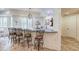 Finished basement wet bar with stone counter, seating for five, and open view to basement at 2400 Weber Heights Way, Buford, GA 30519
