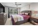 Bedroom with large bed, matching night stands and chest of drawers with a ceiling fan at 4493 Old Hiram Lithia Spgs Rd, Powder Springs, GA 30127