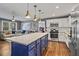 Open floor plan with a large kitchen and stainless steel appliances at 4493 Old Hiram Lithia Spgs Rd, Powder Springs, GA 30127