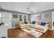 Spacious living room with a comfortable sectional sofa, modern furnishings, and ample natural light at 4493 Old Hiram Lithia Spgs Rd, Powder Springs, GA 30127