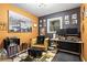 Comfortable office space with a large picture of Paris, decorative shelving, and a workspace with dual monitors at 4493 Old Hiram Lithia Spgs Rd, Powder Springs, GA 30127