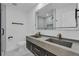 Modern bathroom with double vanity, stylish fixtures, and walk-in shower at 926 Natham Dr, Atlanta, GA 30315