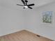 Bright bedroom with modern ceiling fan, natural light from a window, and stylish flooring at 926 Natham Dr, Atlanta, GA 30315